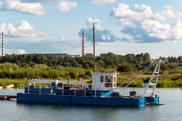 Dredge on water in a sand quarry, mining of nonmetallic materials