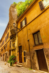 A cobbled old lane in Rome with old dilapided palaces