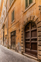 A cobbled old lane in Rome with old dilapided palaces