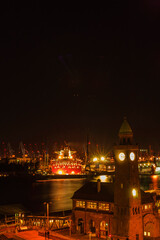 View over Hamburg (Landungsbrücken) with river elbe and cargo ship at night long exposure |...