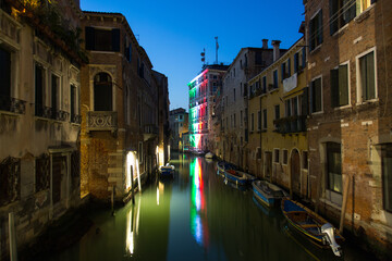 Fototapeta na wymiar Venice cityscape, water canal at night, bridge and traditional buildings. Italy, Europe.
