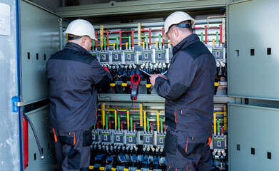 Checking the operating voltage levels of the solar panel switchgear compartment