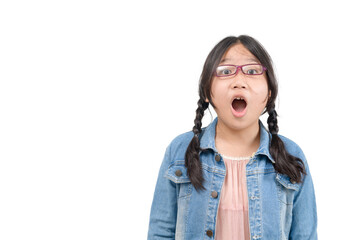 Portrait of surprised cute little asian girl child standing isolated over white background.