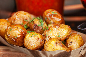 Potatoes baked with herbs .