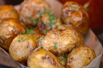 Potatoes baked with herbs .