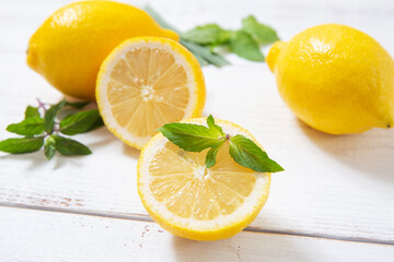Fototapeta na wymiar lemons on white wooden background