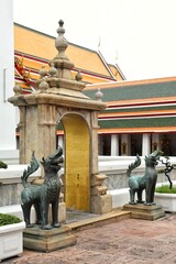 Sheltered gates and bronze sculpted of legends animal at Wat Pho also spelled Wat Po, is a Buddhist...