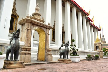 Sheltered gates and bronze sculpted of legends animal at Wat Pho also spelled Wat Po, is a Buddhist...