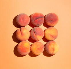 Fresh peaches on pastel background