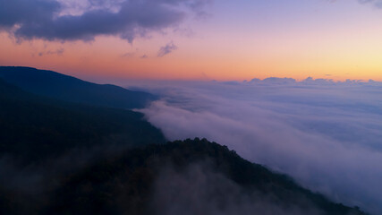 Naklejka na ściany i meble Beautiful sunshine at misty morning mountains at north thailand
