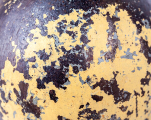 Old battered damaged metal, yellow paint coming off, texture structure macro, extreme closeup. Worn out steel, weathered old rough textured material background, creative artsy grunge backdrop, nobody