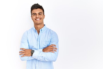 Young hispanic man wearing business shirt standing over isolated background happy face smiling with...
