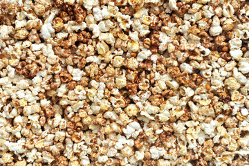 Heap of delicious popcorn. Scattered popcorn texture background.