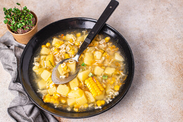 soup vegetables corn, potatoes, pasta alphabet, broth no meat fresh portion meal snack on the table copy space food background rustic. top view keto or paleo diet veggie vegan or vegetarian food