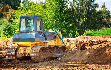 Dozer at construction works, heavy duty bulldozer leveling ground. Heavy machinery, level ground....