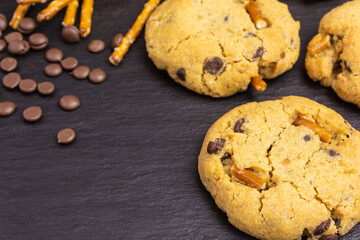 chocolate chip peanut butter cookies with pretzel sticks