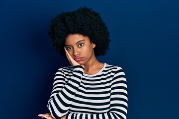 Fototapeta na wymiar Young african american woman wearing casual clothes thinking looking tired and bored with depression problems with crossed arms.