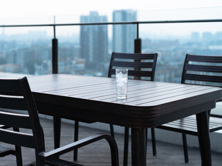 a glass of water on the terrace table
