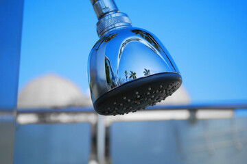 Obraz premium Closeup of outdoor shower head. Outdoor pool shower.