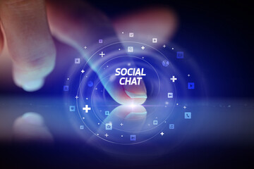Finger touching tablet with social media icons concept