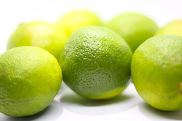 bunch of lemons on white background, green fruit on white background, texture of lemons, lemon texture