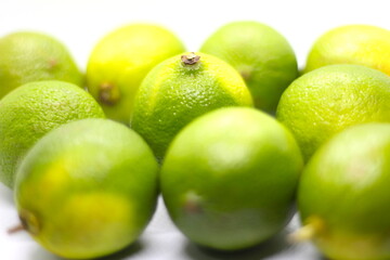 bunch of lemons on white background, green fruit on white background, texture of lemons, lemon texture