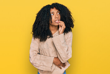 Young african american girl wearing casual clothes looking stressed and nervous with hands on mouth biting nails. anxiety problem.