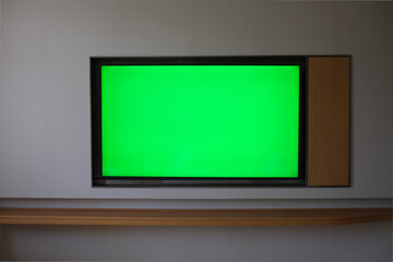 large green screen TV on wall at day