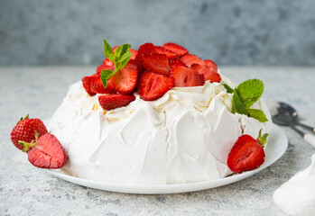 Pavlova cake with cream and strawberries - obrazy, fototapety, plakaty