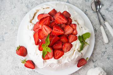 Pavlova cake with cream and strawberries, selective focus - obrazy, fototapety, plakaty