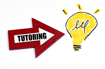 There is a lamp drawn on the sheet with a wooden arrow pointing at it with the inscription - TUTORING