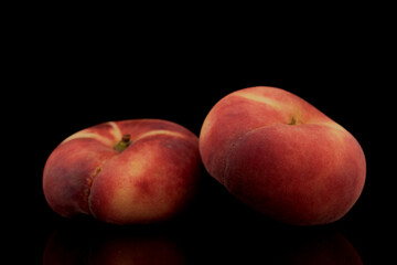 Fototapeta na wymiar Two organic ripe fig peaches, close-up, isolated on black.