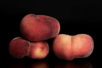 Fototapeta na wymiar Three organic ripe fig peaches, close-up, isolated on black.