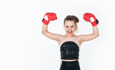 teen girl boxer training in boxing gloves, copy space, winner