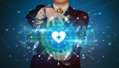 Obraz premium Hand holding healthcare icons concept