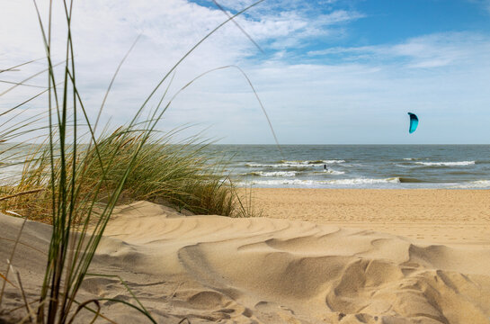 Beach and kitesurfer