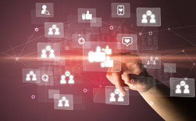 Hand pressing social media multimedia application screen with media icons on futuristic concept