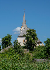 The Church of Maria Worth at Lake Worthersee in Carinthia, Austria in Summer.