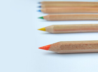 Multicolored pencils on a white background