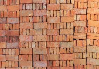 Fototapeta premium Traditional Red Bricks Stack near a Construction Site in India
