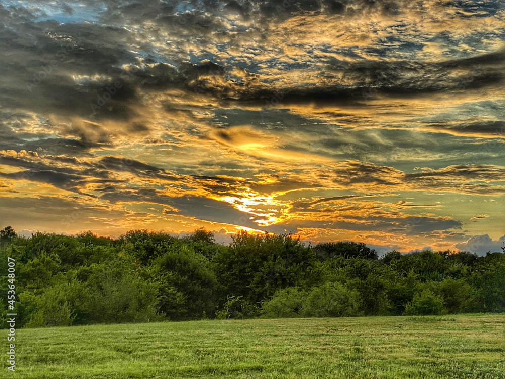 Poster sunset over the field