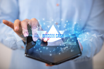 Businessman holding a foldable smartphone, business concept