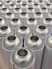Empty aerosol cans awaiting manufacturing process