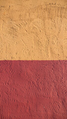 Pared de estuco pintado de rojo y amarillo