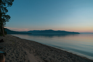 Picturesque view of Lake Baikal in sunrise .Rift lake located in southern Siberia, Russia. The largest freshwater lake by volume in the world. A Natural Wonder Of The World.