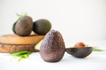 Haas avocado on a wooden board, natural products