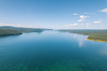 The Angara River is a major river in Siberia leaving Lake Baikal near the settlement of Listvyanka. Panoramic aerial view.