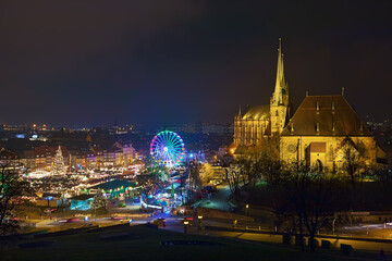 Erfurt, Germany. Christmas market on Domplatz (Cathedral Square) at the foot of Domberg (Cathedral Hill) with St Mary's Cathedral and Church of St Severus in night. View from Petersberg hill. - 453656086