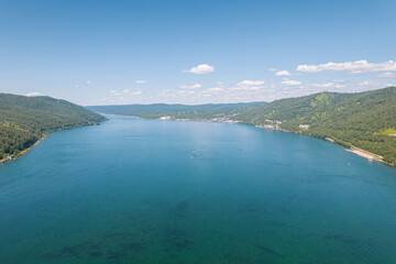 The Angara River is a major river in Siberia leaving Lake Baikal near the settlement of Listvyanka. Panoramic aerial view.