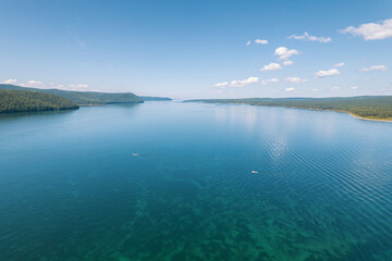 The Angara River is a major river in Siberia leaving Lake Baikal near the settlement of Listvyanka. Panoramic aerial view.